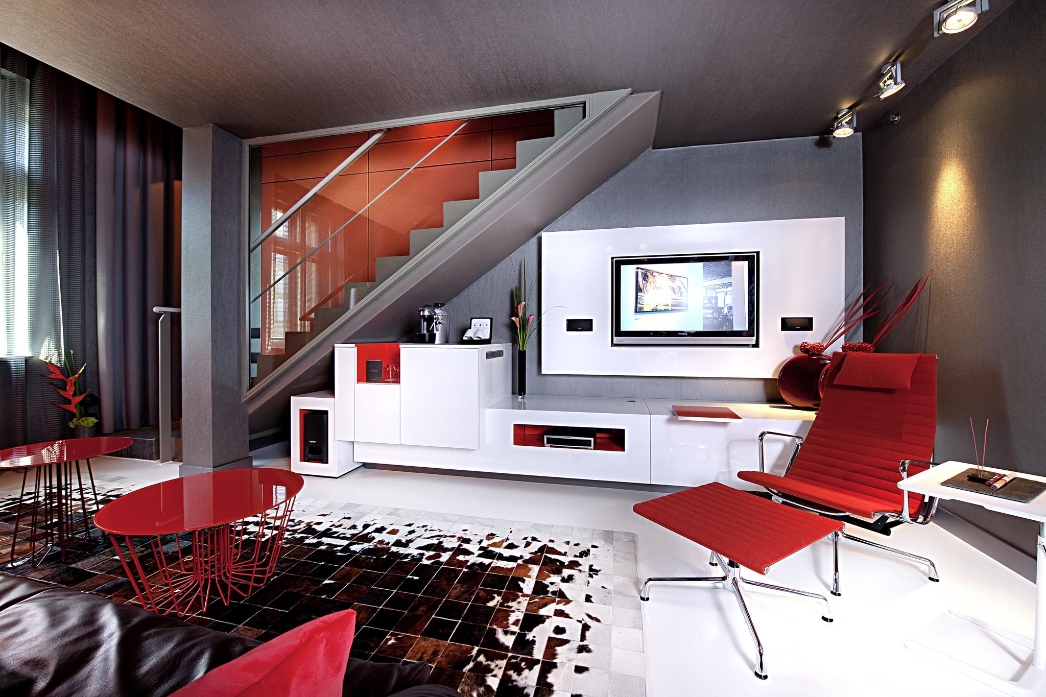 Sofitel Munich Bayerpost Hotel Exterior photo A living room with a flat screen television